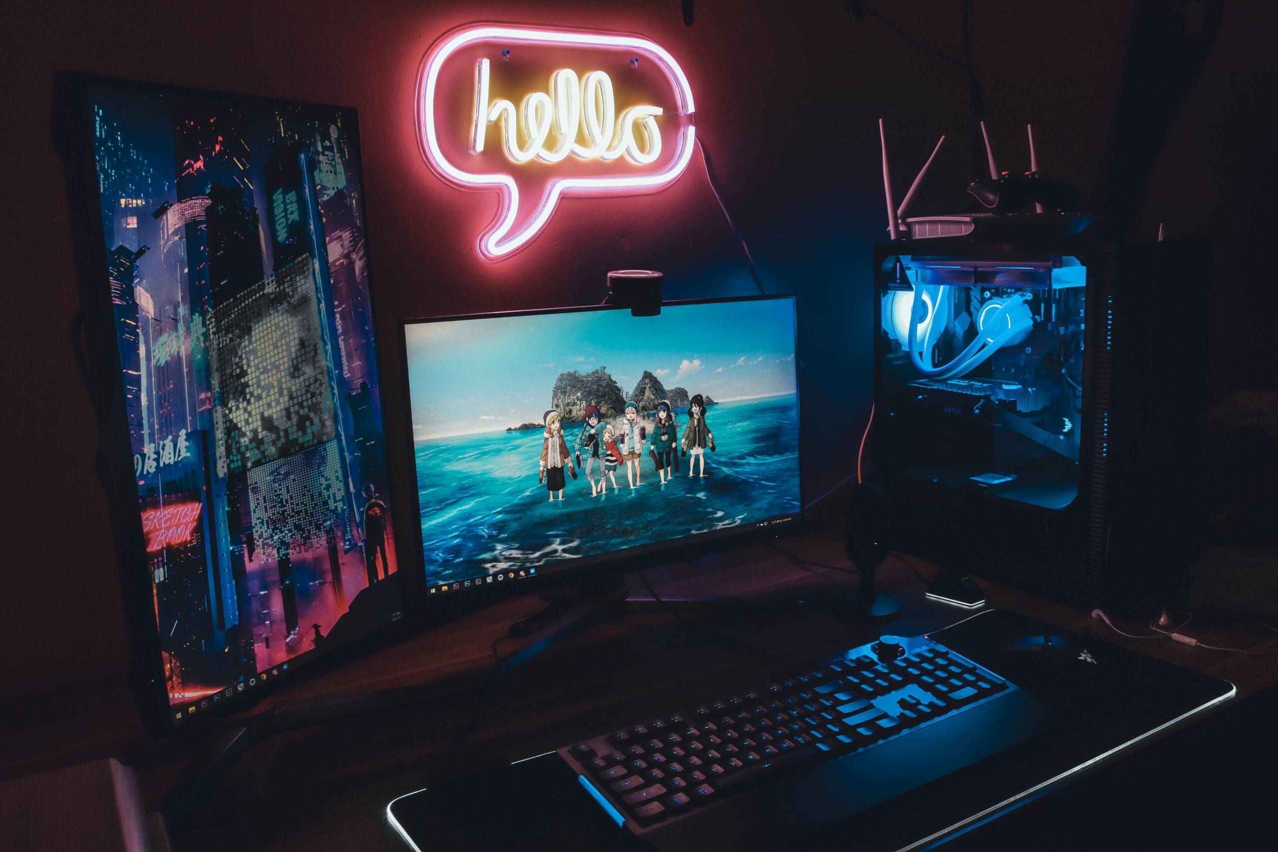 PC gaming cafe setup with dual monitors and neon lighting
